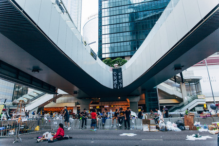 HONG KONG, OCT 2: Crowd of protesters occupy the road in Admiralty on 2 October 2014. Hong Kong people are fighting for a real universal suffrage for the next chief executive election.のeditorial素材