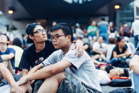 HONG KONG, OCT 4: Crowd of protesters occupy the road in Admiralty on 4 October 2014. Hong Kong people are fighting for a real universal suffrage for the next chief executive election.のeditorial素材