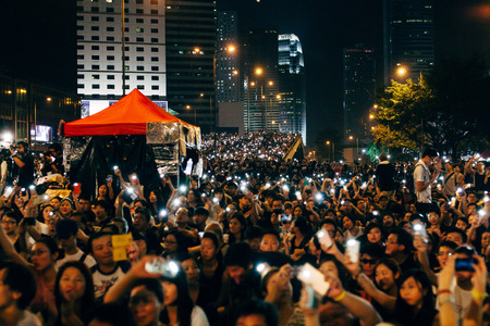 HONG KONG, OCT 4: Crowd of protesters occupy the road in Admiralty on 4 October 2014. Hong Kong people are fighting for a real universal suffrage for the next chief executive election.のeditorial素材