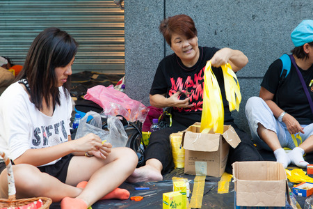 HONG KONG, OCT 1: Crowd of protesters occupy the road in Mongkok on 1 October 2014. Hong Kong people are fighting for a real universal suffrage for the next chief executive election.のeditorial素材