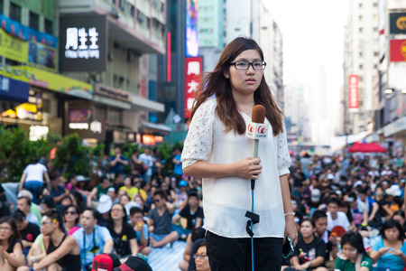 HONG KONG, OCT 1: Crowd of protesters occupy the road in Mongkok on 1 October 2014. Hong Kong people are fighting for a real universal suffrage for the next chief executive election.のeditorial素材