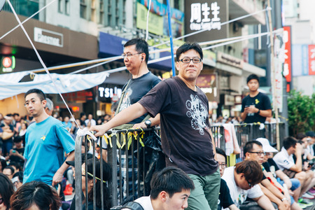 HONG KONG, OCT 1: Crowd of protesters occupy the road in Mongkok on 1 October 2014. Hong Kong people are fighting for a real universal suffrage for the next chief executive election.のeditorial素材