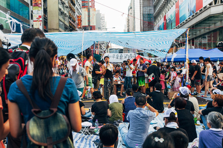 HONG KONG, OCT 1: Crowd of protesters occupy the road in Mongkok on 1 October 2014. Hong Kong people are fighting for a real universal suffrage for the next chief executive election.のeditorial素材