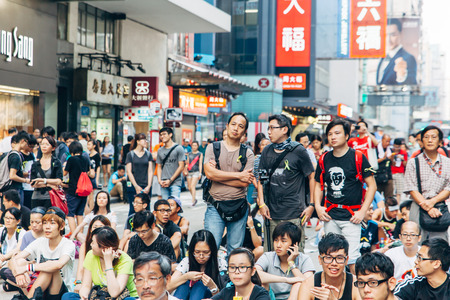 HONG KONG, OCT 1: Crowd of protesters occupy the road in Mongkok on 1 October 2014. Hong Kong people are fighting for a real universal suffrage for the next chief executive election.のeditorial素材