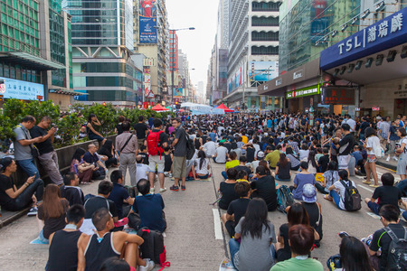 HONG KONG, OCT 1: Crowd of protesters occupy the road in Mongkok on 1 October 2014. Hong Kong people are fighting for a real universal suffrage for the next chief executive election.のeditorial素材