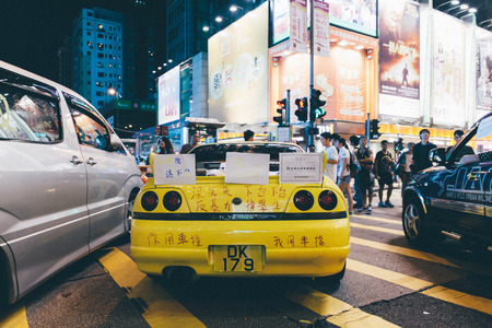 HONG KONG, OCT 1: Crowd of protesters occupy the road in Mongkok on 1 October 2014. Hong Kong people are fighting for a real universal suffrage for the next chief executive election.のeditorial素材