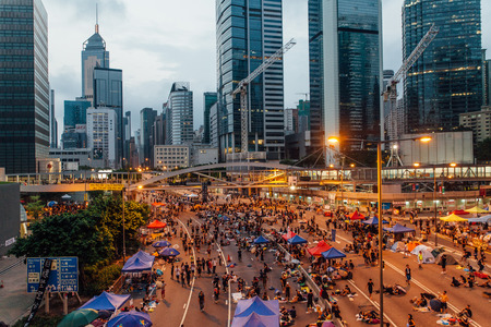 HONG KONG, OCT 2: Crowd of protesters occupy the road in Admiralty on 2 October 2014. Hong Kong people are fighting for a real universal suffrage for the next chief executive election.のeditorial素材