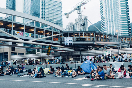HONG KONG, OCT 2: Crowd of protesters occupy the road in Admiralty on 2 October 2014. Hong Kong people are fighting for a real universal suffrage for the next chief executive election.のeditorial素材