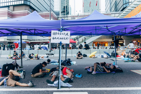 HONG KONG, OCT 2: Crowd of protesters occupy the road in Admiralty on 2 October 2014. Hong Kong people are fighting for a real universal suffrage for the next chief executive election.のeditorial素材