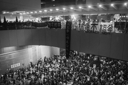 HONG KONG, OCT 3: Crowd of protesters occupy the road in Admiralty on 3 October 2014. Hong Kong people are fighting for a real universal suffrage for the next chief executive election.のeditorial素材