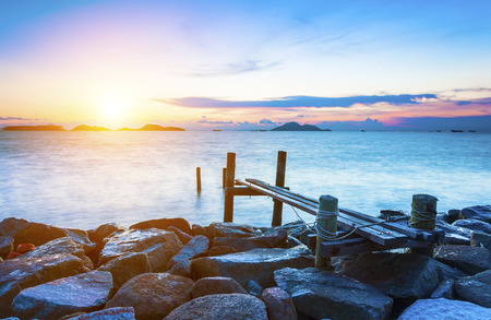 Pier over sunset watersの写真素材