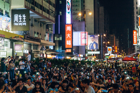 HONG KONG, OCT 1: Crowd of protesters occupy the road in Mongkok on 1 October 2014. Hong Kong people are fighting for a real universal suffrage for the next chief executive election.のeditorial素材