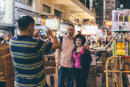 HONG KONG, OCT 23: Umbrella Revolution in Mongkok on 23 October 2014. Ms. Wong Har Wai, a famous Hong Kong artist arrives the occupied zone to supportのeditorial素材