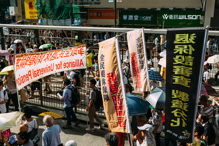 HONG KONG - JULY 1: Hong Kong people show their dissatisfaction to the Hong Kong government by march on July 1, 2015 in Hong Kong. Organizers of protest claimed a turnout of 48,000 people.のeditorial素材