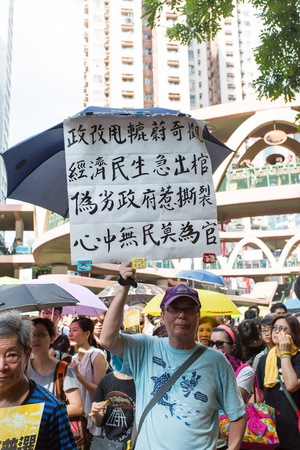 HONG KONG - JULY 1: Hong Kong people seek greater democracy as frustration grows over the influence of Beijing on July 1, 2015 in Hong Kong. Organizers of protest claimed a turnout of 48,000 people.のeditorial素材