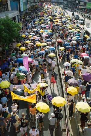 HONG KONG - JULY 1: Hong Kong people show their dissatisfaction to the Hong Kong government by march on July 1, 2015 in Hong Kong. Organizers of protest claimed a turnout of 48,000 people.のeditorial素材