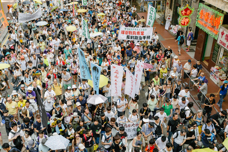 HONG KONG - JULY 1: Hong Kong people show their dissatisfaction to the Hong Kong government by march on July 1, 2015 in Hong Kong. Organizers of protest claimed a turnout of 48,000 people.のeditorial素材