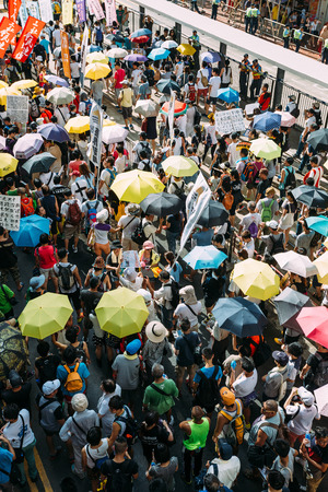 HONG KONG - JULY 1: Hong Kong people show their dissatisfaction to the Hong Kong government by march on July 1, 2015 in Hong Kong. Organizers of protest claimed a turnout of 48,000 people.のeditorial素材