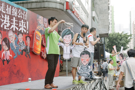 HONG KONG - JULY 1: Hong Kong people show their dissatisfaction to the Hong Kong government by march on July 1, 2015 in Hong Kong. Organizers of protest claimed a turnout of 48,000 people.のeditorial素材