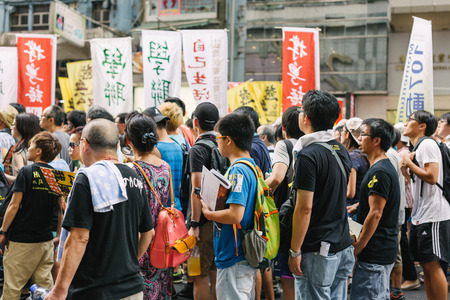 HONG KONG - JULY 1: Hong Kong people show their dissatisfaction to the Hong Kong government by march on July 1, 2015 in Hong Kong. Organizers of protest claimed a turnout of 48,000 people.のeditorial素材