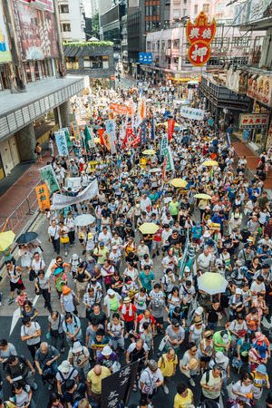 HONG KONG - JULY 1: Hong Kong people seek greater democracy as frustration grows over the influence of Beijing on July 1, 2015 in Hong Kong. Organizers of protest claimed a turnout of 48,000 people.のeditorial素材