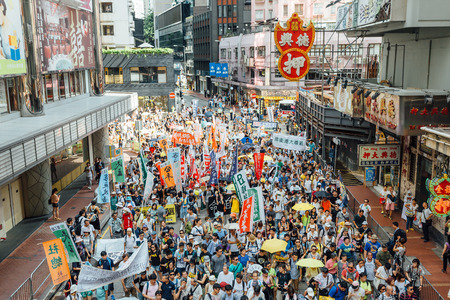 HONG KONG - JULY 1: Hong Kong people seek greater democracy as frustration grows over the influence of Beijing on July 1, 2015 in Hong Kong. Organizers of protest claimed a turnout of 48,000 people.のeditorial素材