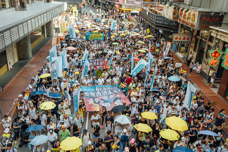 HONG KONG - JULY 1: Hong Kong people seek greater democracy as frustration grows over the influence of Beijing on July 1, 2015 in Hong Kong. Organizers of protest claimed a turnout of 48,000 people.のeditorial素材