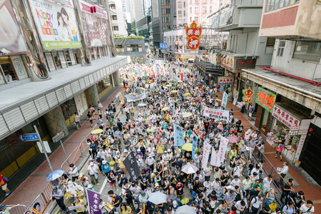 HONG KONG - JULY 1: Hong Kong people show their dissatisfaction to the Hong Kong government by march on July 1, 2015 in Hong Kong. Organizers of protest claimed a turnout of 48,000 people.のeditorial素材