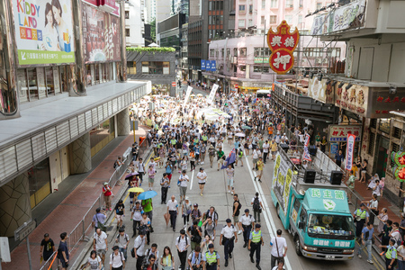HONG KONG - JULY 1: Hong Kong people seek greater democracy as frustration grows over the influence of Beijing on July 1, 2015 in Hong Kong. Organizers of protest claimed a turnout of 48,000 people.のeditorial素材