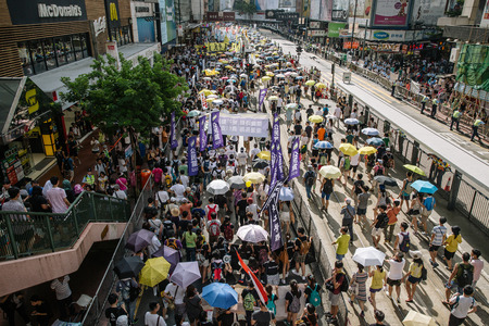 HONG KONG - JULY 1: Hong Kong people show their dissatisfaction to the Hong Kong government by march on July 1, 2015 in Hong Kong. Organizers of protest claimed a turnout of 48,000 people.のeditorial素材