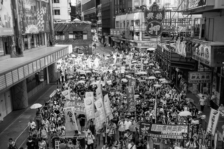 HONG KONG - JULY 1: Hong Kong people show their dissatisfaction to the Hong Kong government by march on July 1, 2015 in Hong Kong. Organizers of protest claimed a turnout of 48,000 people.のeditorial素材