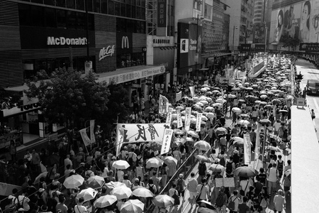 HONG KONG - JULY 1: Hong Kong people show their dissatisfaction to the Hong Kong government by march on July 1, 2015 in Hong Kong. Organizers of protest claimed a turnout of 48,000 people.のeditorial素材