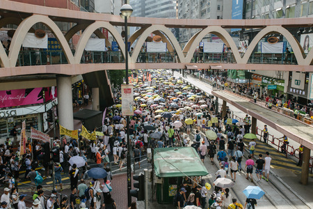 HONG KONG - JULY 1: Hong Kong people show their dissatisfaction to the Hong Kong government by march on July 1, 2015 in Hong Kong. Organizers of protest claimed a turnout of 48,000 people.のeditorial素材