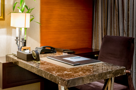 Interior room work table with planner, pen,  and coffee cup.の写真素材