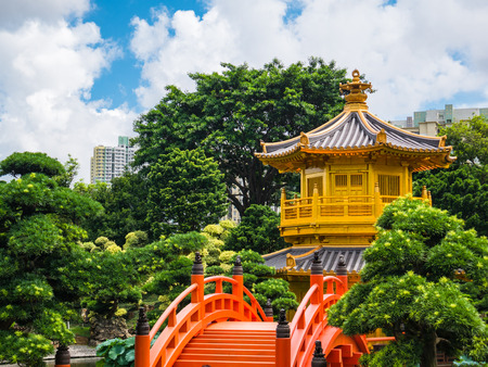 Golden pavilion of absolute perfection in Nan Lian Garden in Chi Lin Nunnery, Hong Kong, China. Taken in the summer, the Pavillion sits on a hill that is now surrounded by high rise apartmentsのeditorial素材