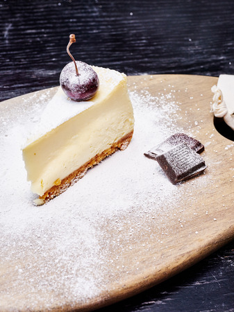 Cheescake with Blueberry sprinkled with icing sugarの写真素材