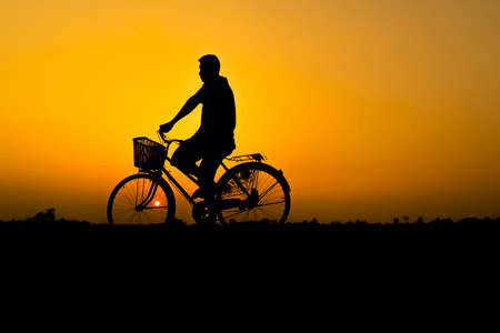 Bicycle in silhouette of the sunset.の写真素材