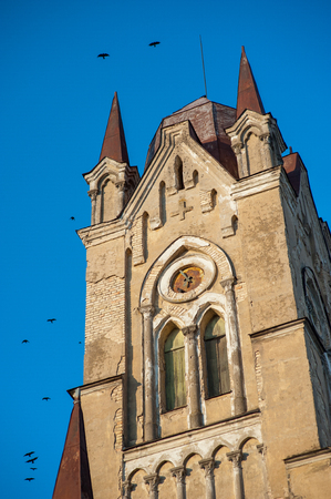 black crows hang over the old monastery.の写真素材