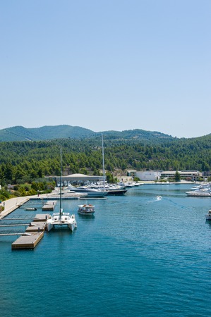 Berth for yachts and ships, parking near the mountains.の写真素材