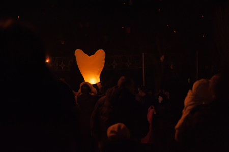 Launch balloons on Valentine's Day, late in the evening.の写真素材