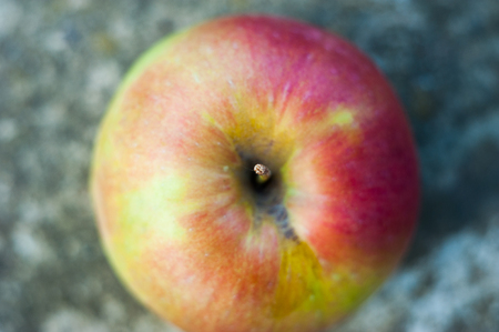 Red single apple against white background top down view stock footageの写真素材
