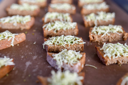 Bread from the oven with seasonings. Cooking delicacies for guests.