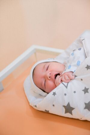 baby in the hospital. The newborn sleeps calmly inside. before leaving the polyclinic.の写真素材