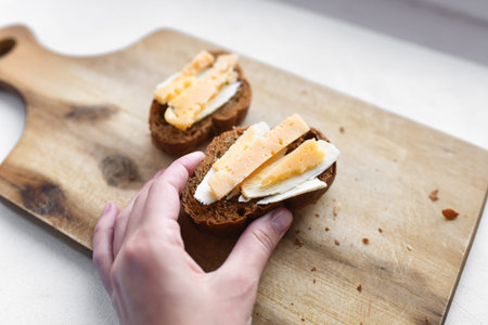 sandwiches with cheese. for breakfast. multi-colored plate. board. homemade breakfast. Cheese...