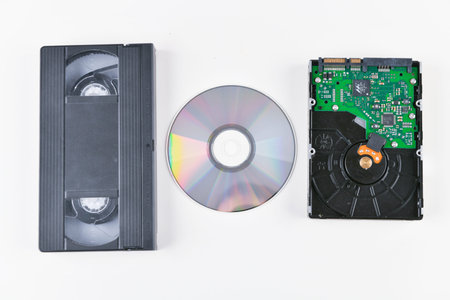 the evolution of the film. change of media. video cassette, disk, hard drive. close-up. place to...