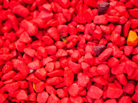 red little pebbles. The background consists of small red pebbles. With many possible uses. The...