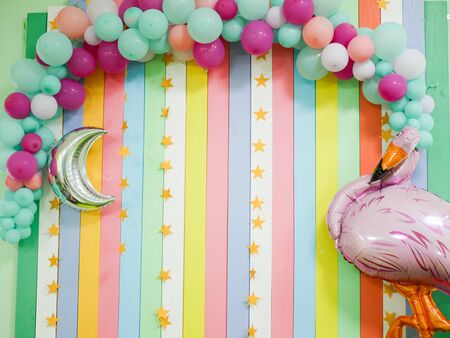 festive background for the birthday of the child. zone for photographing holidays. made of colorful stripes and balls. Paste man on a festive backgroundの写真素材
