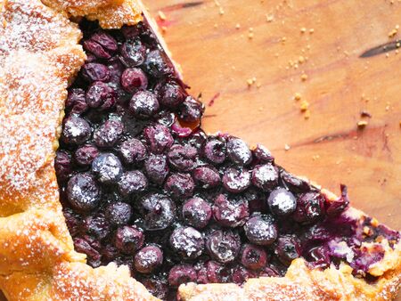 blueberry pie on a wooden plate. close-up. view from above. place for writing.の写真素材