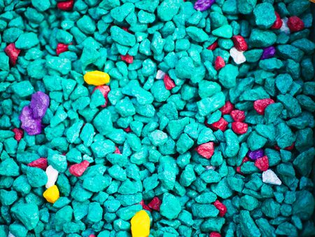 fine turquoise pebbles. The background consists of small turquoise pebbles. With many possible uses. The texture consists of tiny turquoise pebbles. close-up.の写真素材