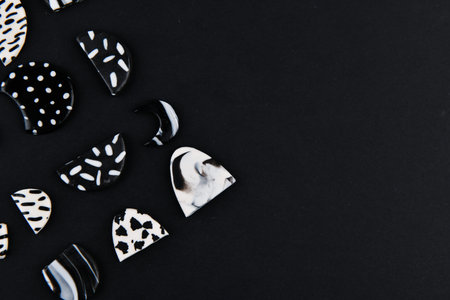A product from polymer clay. Black and white polymer clay. Hand sculpting, product for earrings on a...